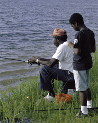 Father and son fishing/ credit USFWS